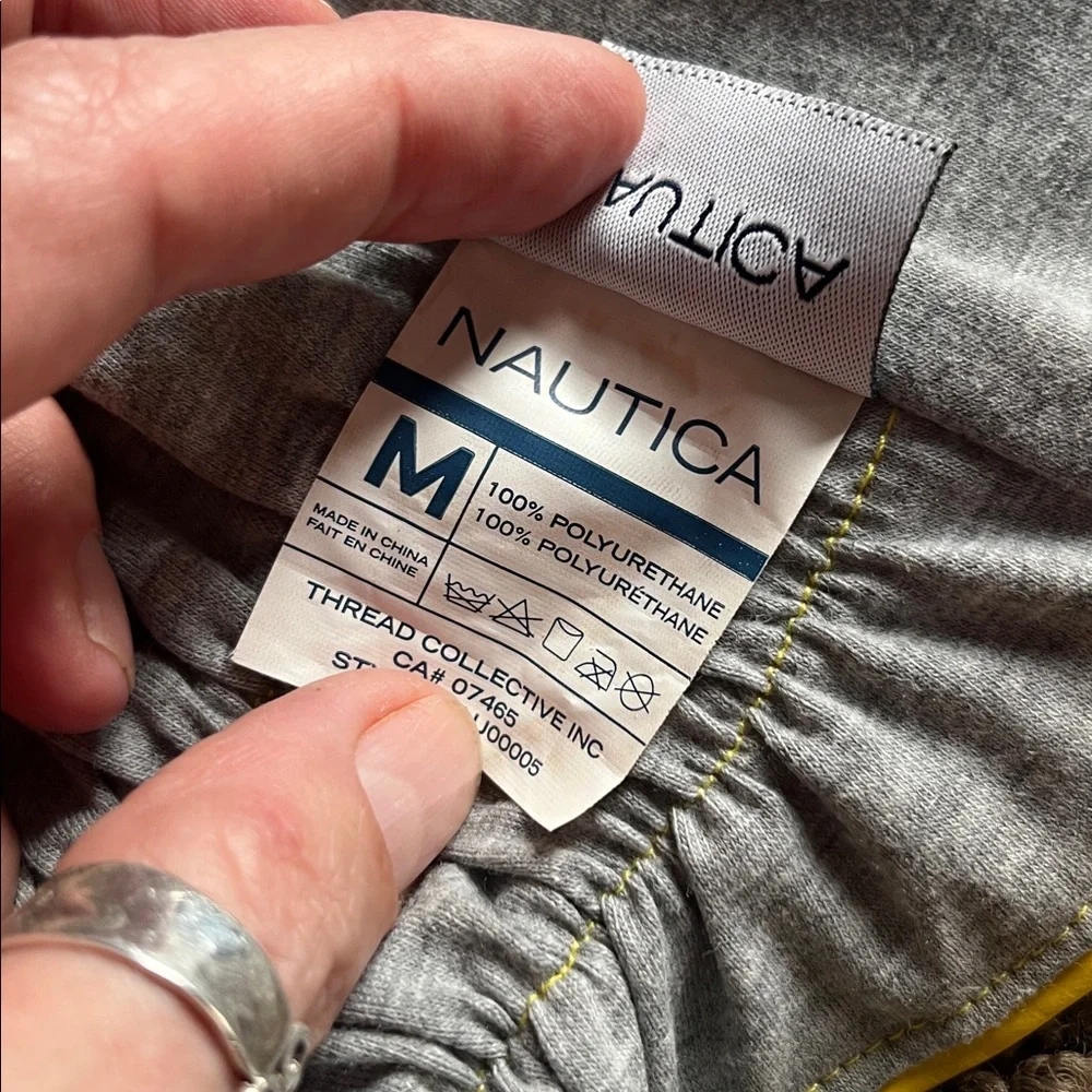 Nautica Dog Raincoat size medium. With snap back hood